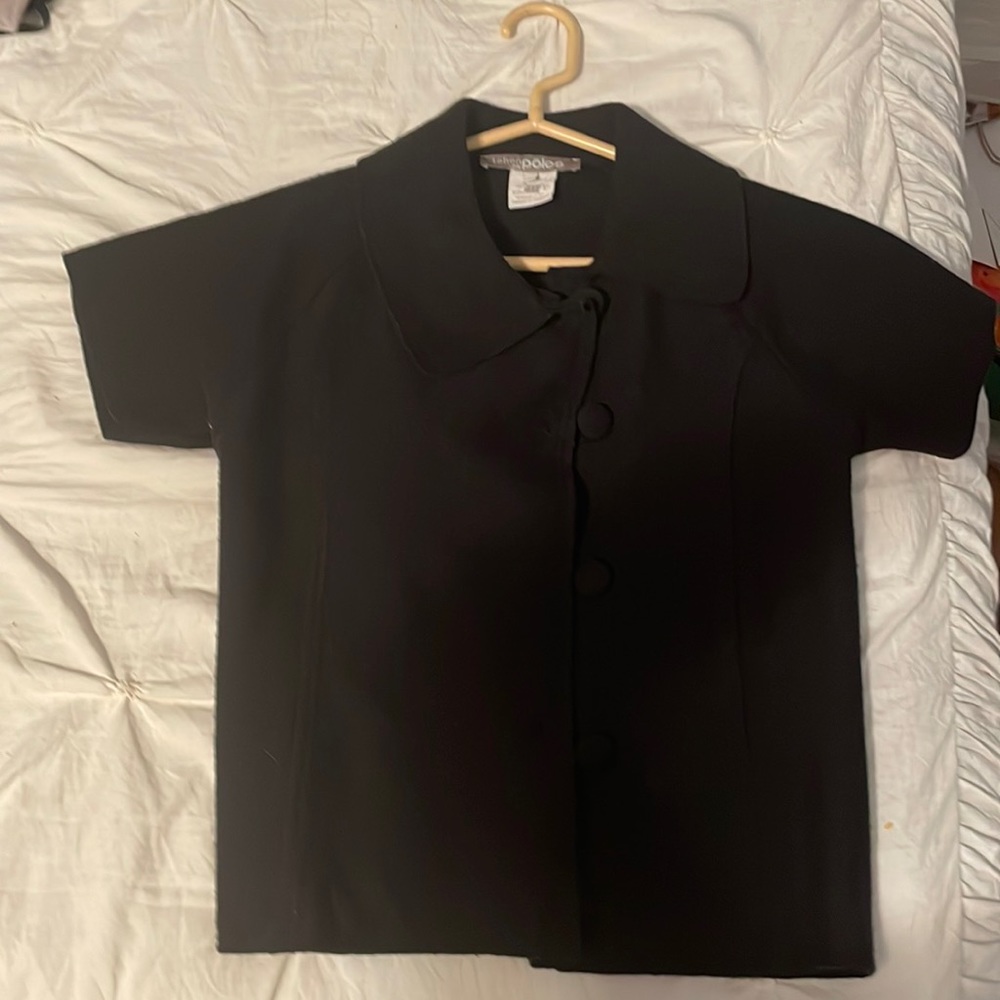 This is a collared button-down European article of clothes